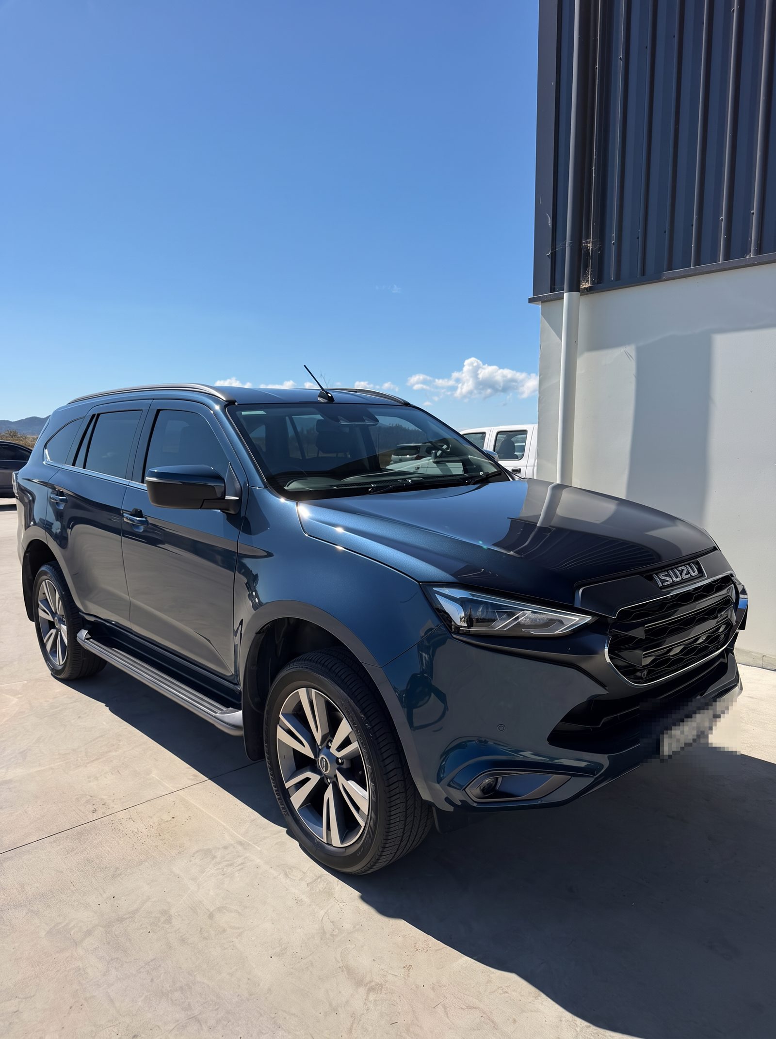 Work vehicle detailed on-site for a Townsville business